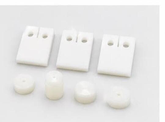 PEEK implant blocks and balls for spinal and dental applications.